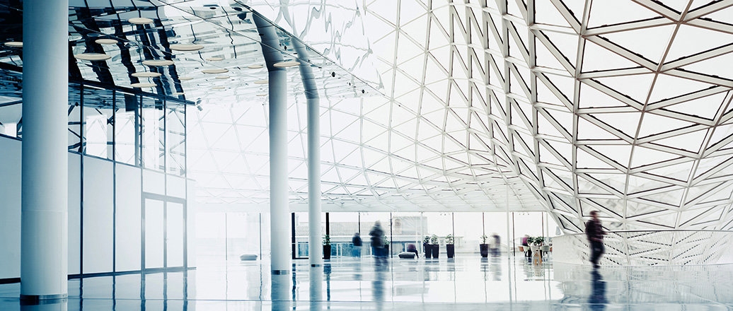 interior of a large building with huge glass windows in triangular sections interior of a large building with huge glass windows in triangular sections