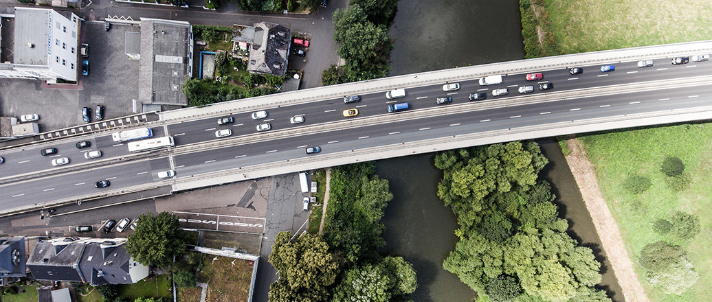 River and highway crossing a town, aerial view River and highway crossing a town, aerial view