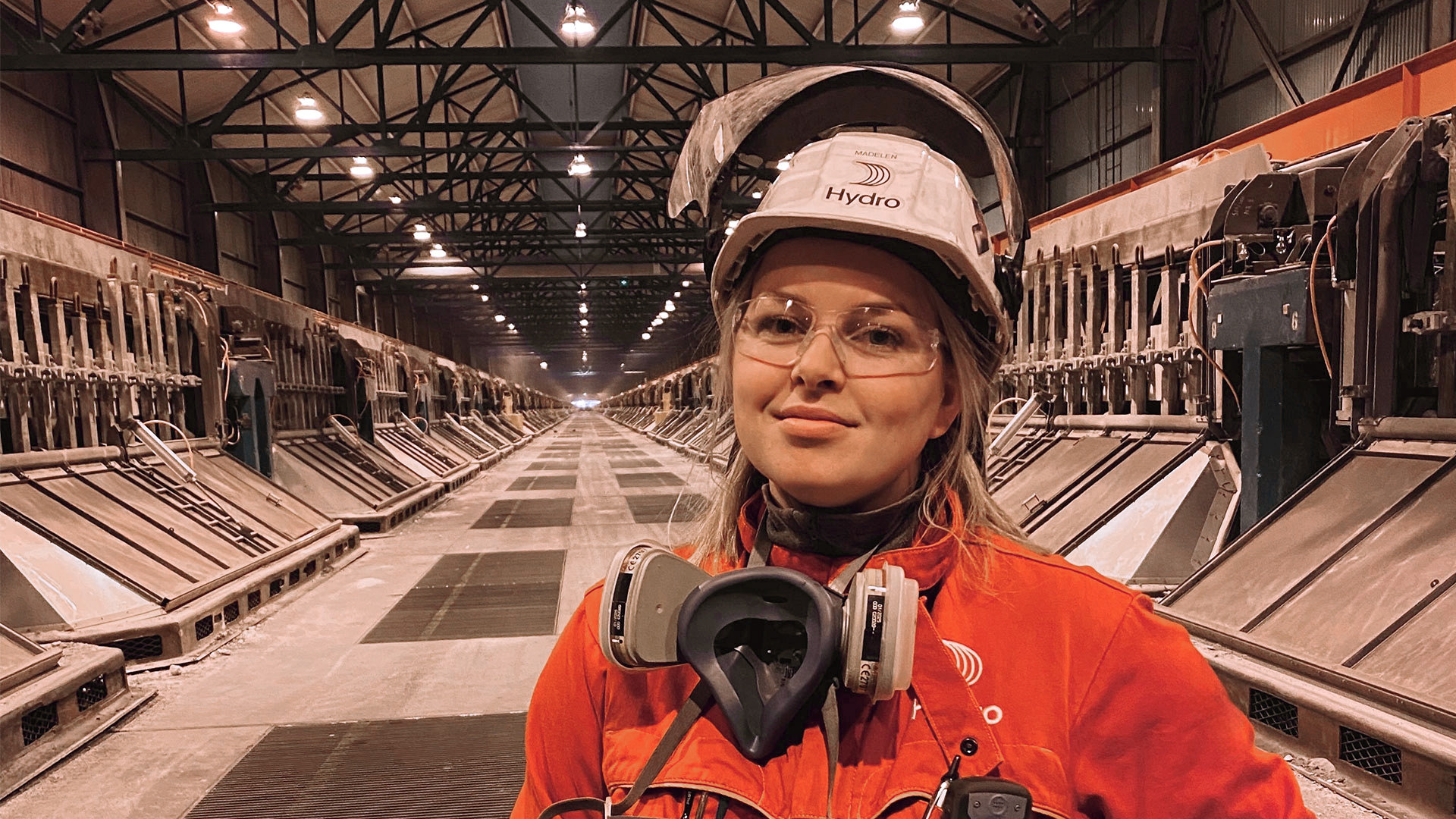 a person wearing a helmet and headphones in a warehouse