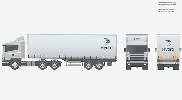 large truck with logo placed top back, front and center above cab, front and center on rear doors.