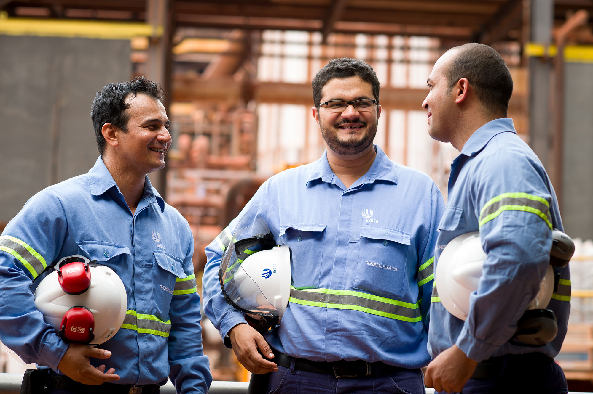a group of men in blue shirts