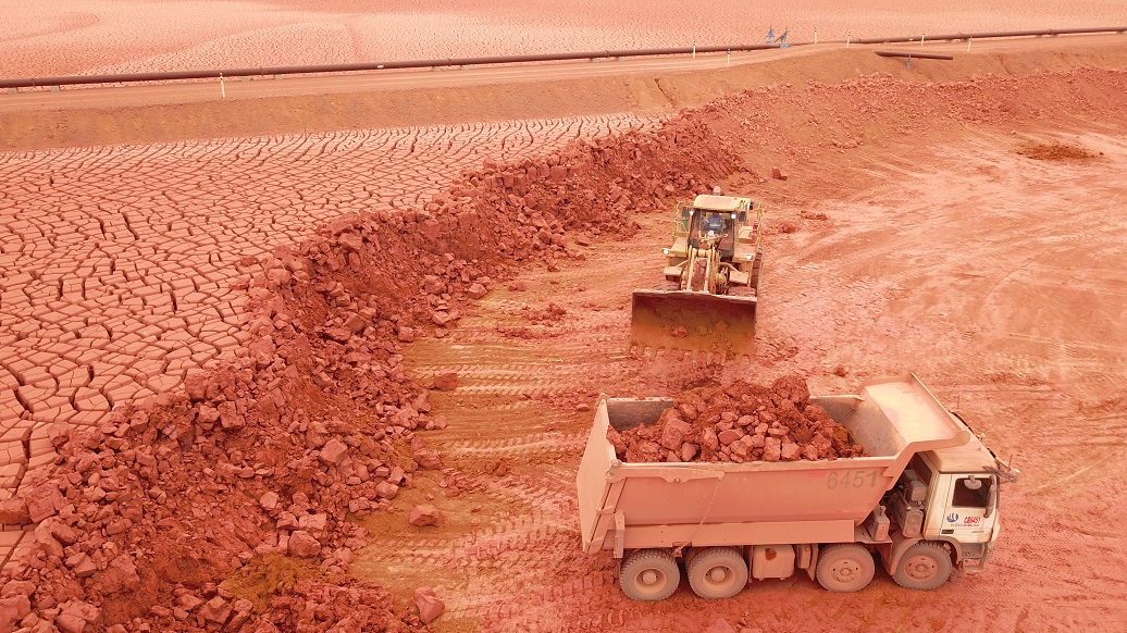 a few trucks in a field
