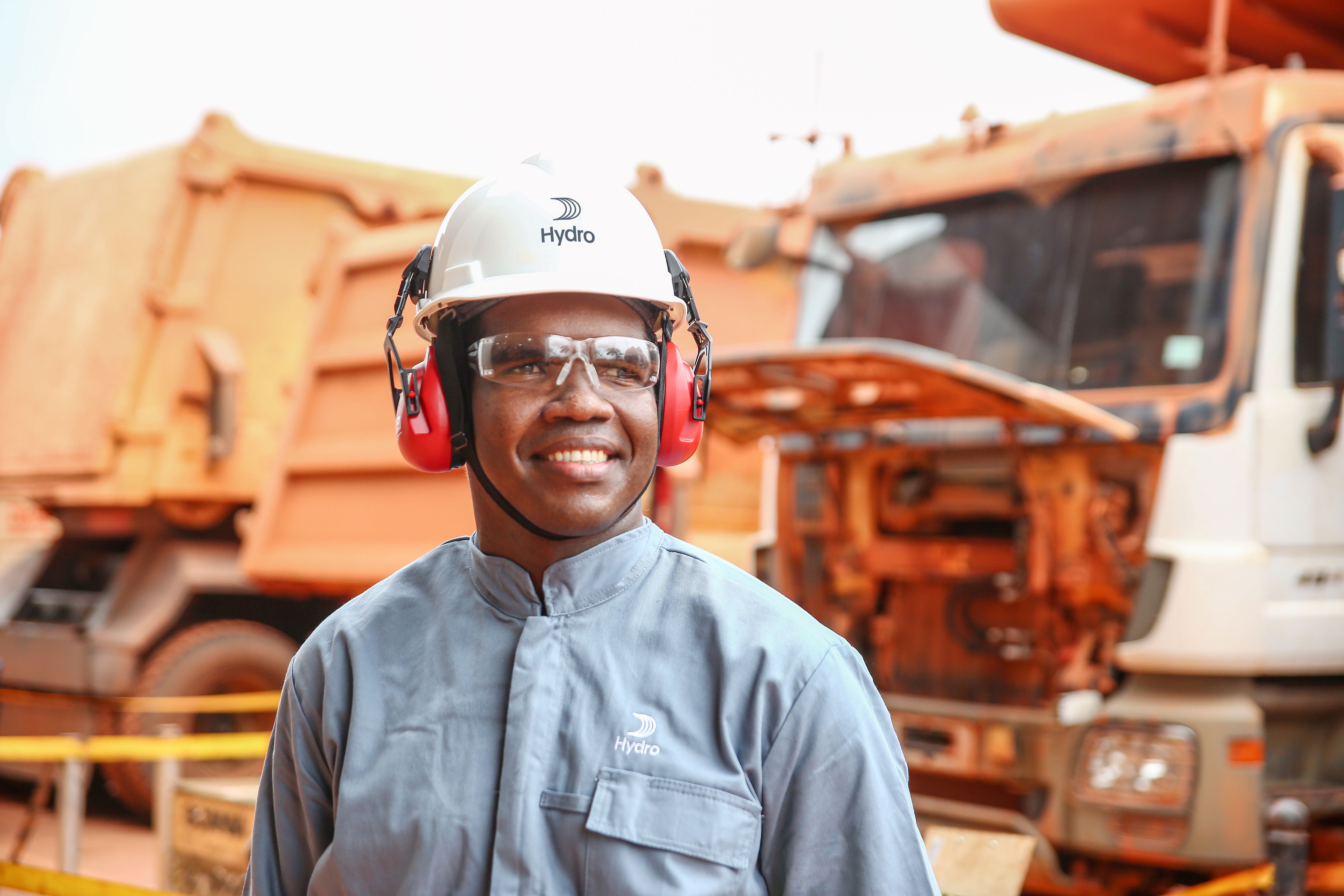 a man wearing a hard hat and earphones