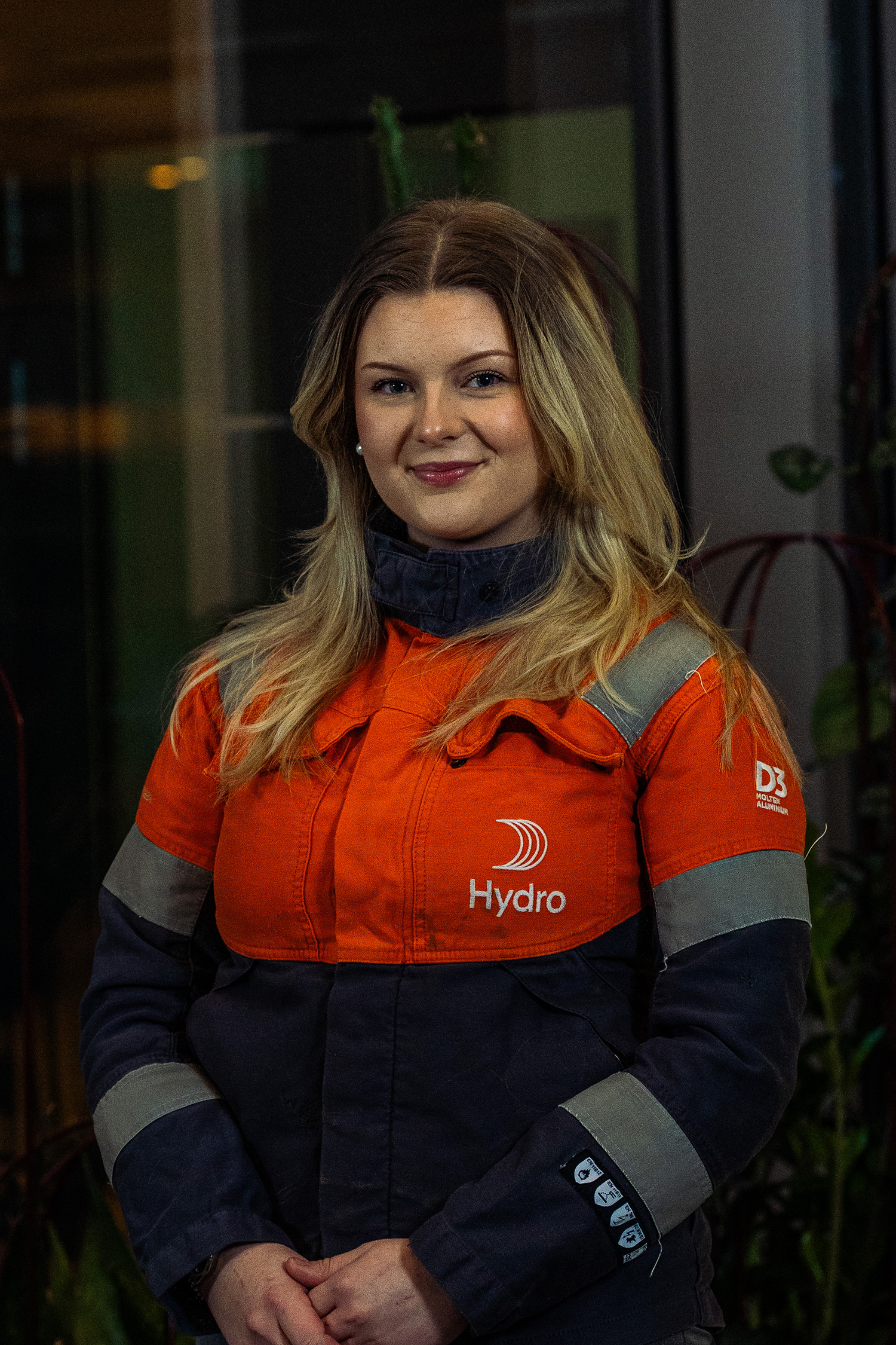 a woman in an orange and black jacket