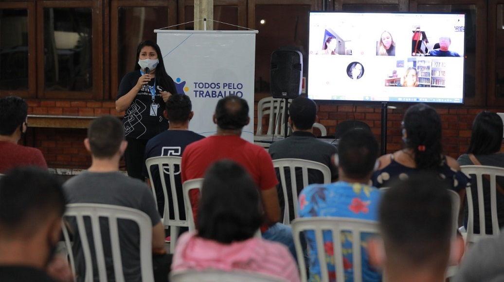 a person giving a presentation to a group of people