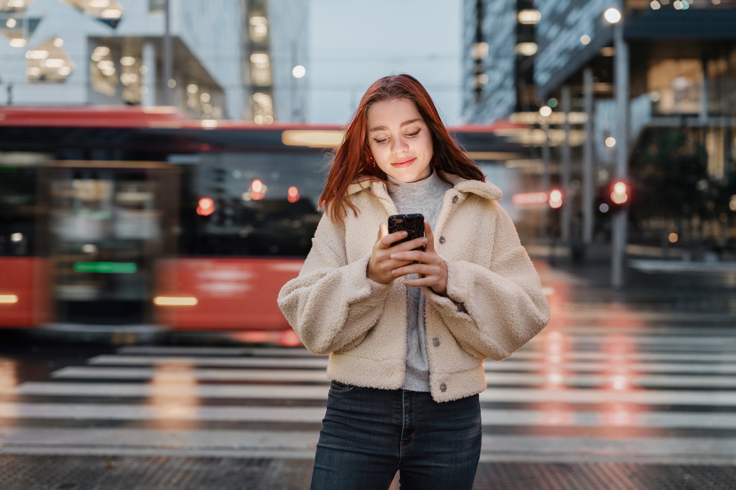 a woman holding a phone