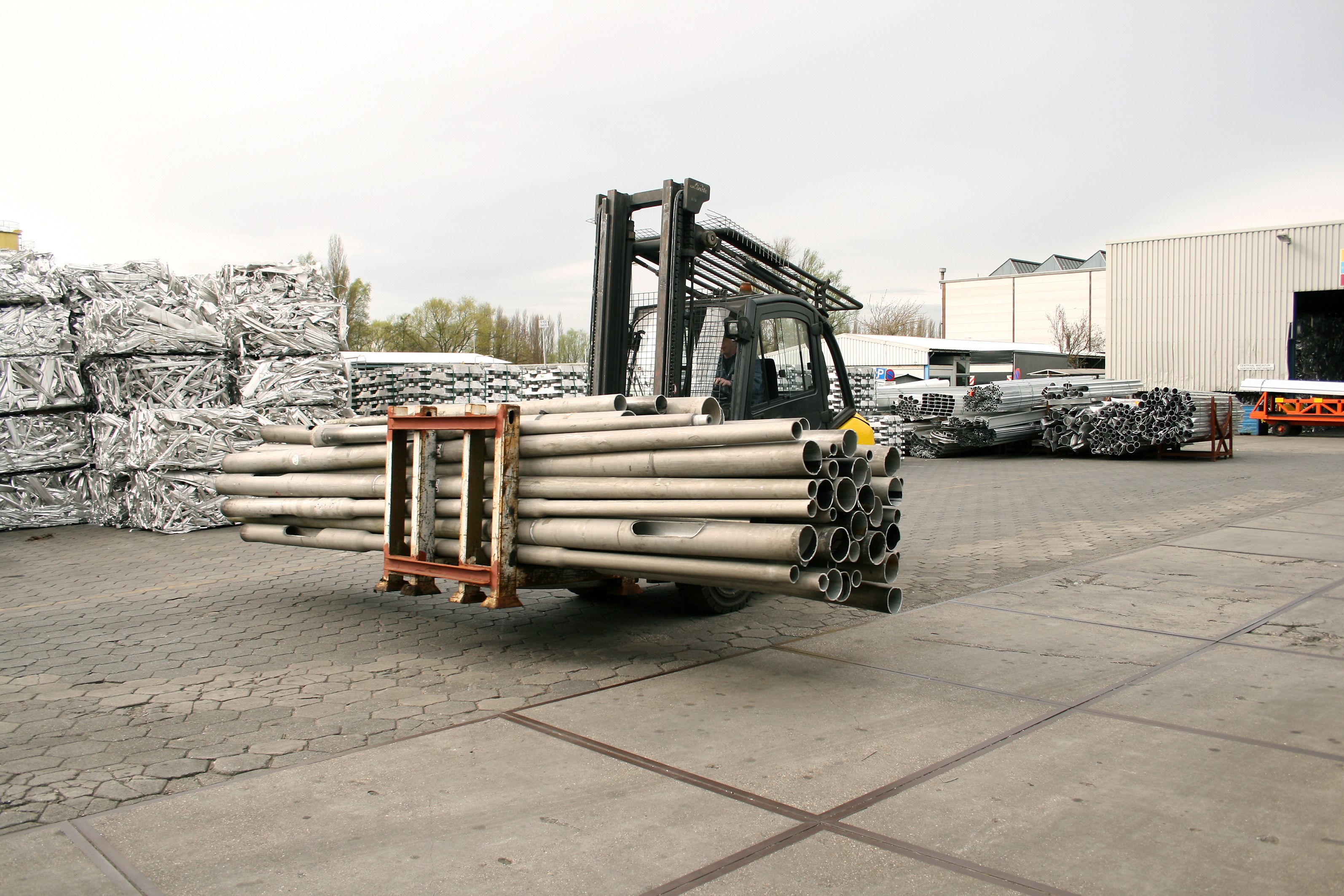 a machine with a pile of wood