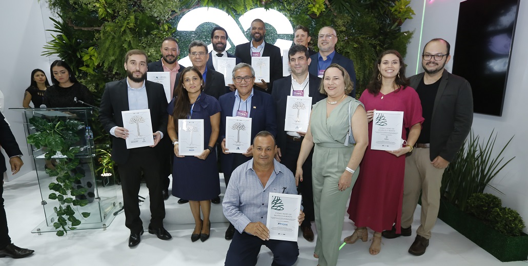 a group of people holding certificates