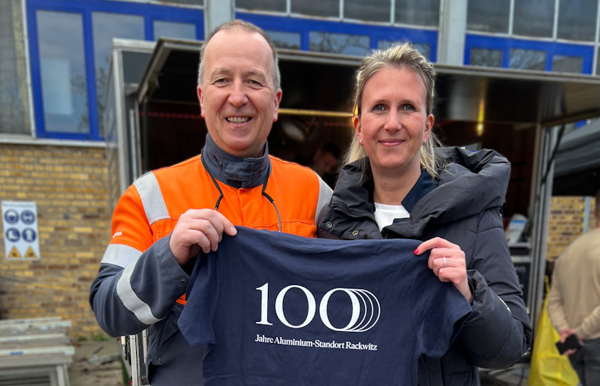 a man and woman holding a t-shirt a man and woman holding a t-shirt