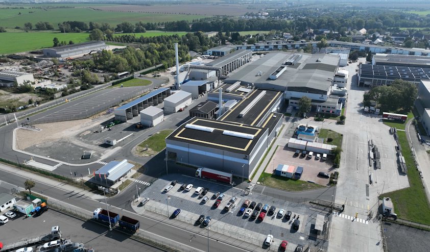 a factory and a parking lot a factory and a parking lot