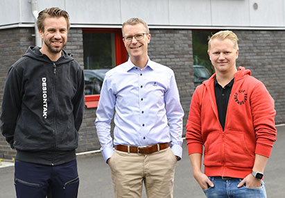 a group of men posing for a photo